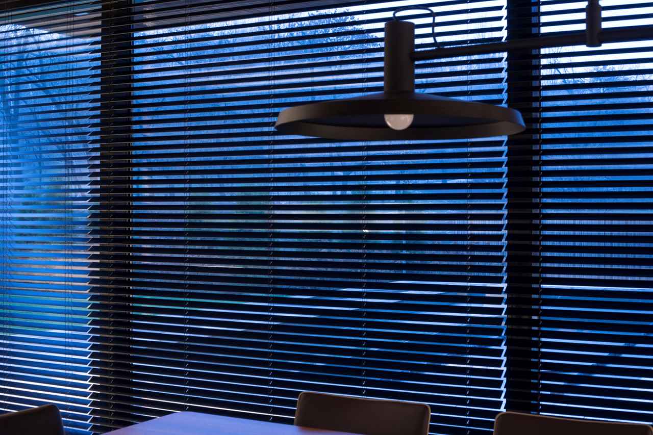 Motorized venetian wooden blinds closeup