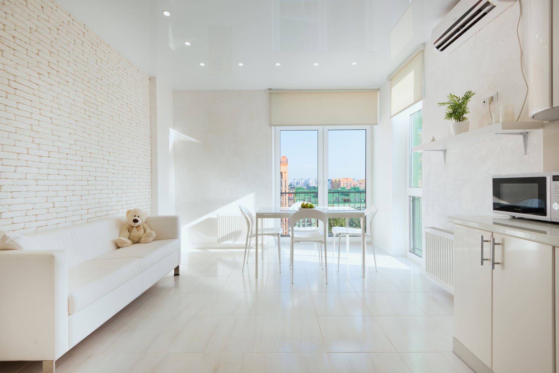living room with motorised blinds installed on the windows